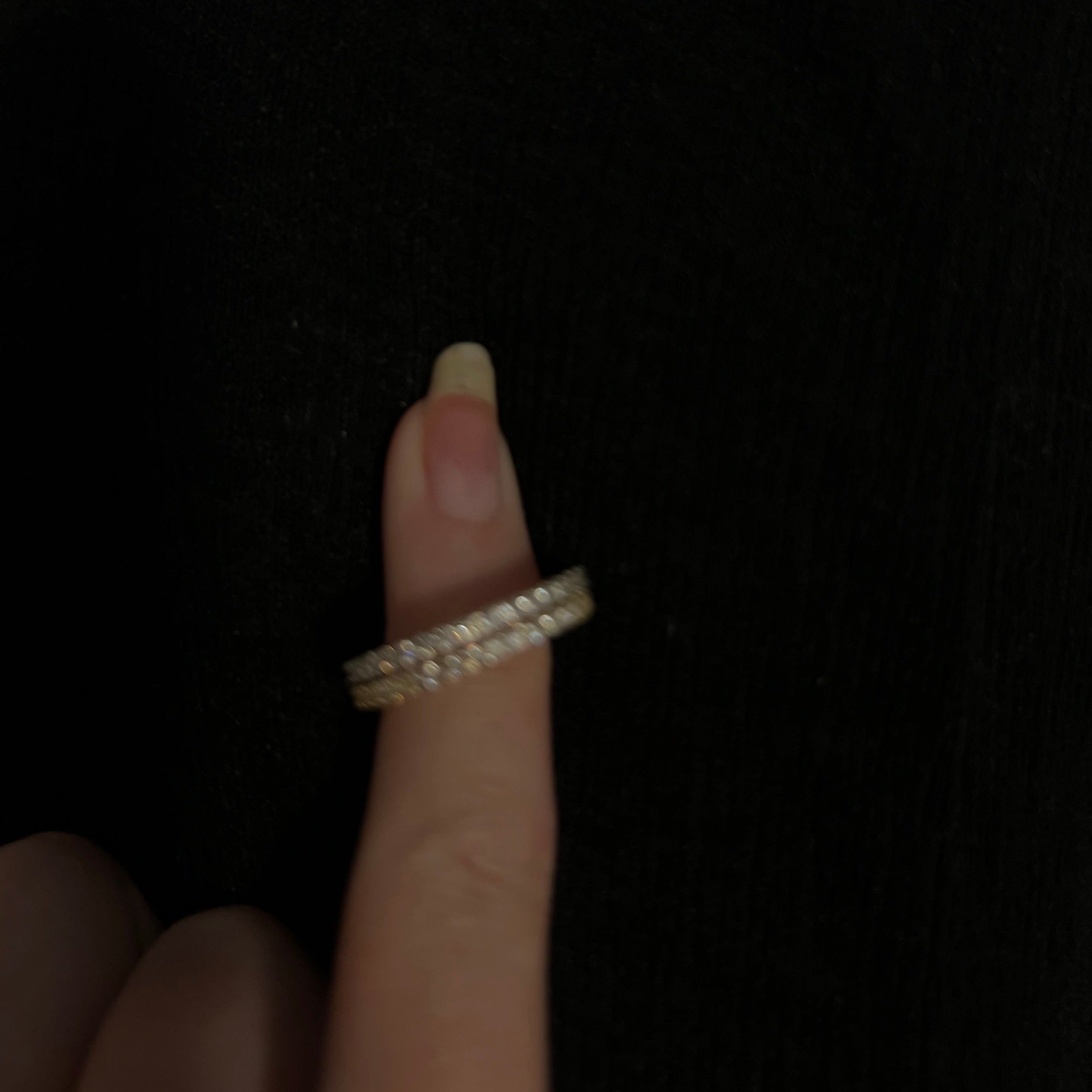 Eternity rings on hand, angle 